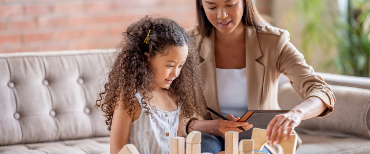 Types of therapies at Inspire Counseling Group A counselor playing with blocks to assess a child's mental health
